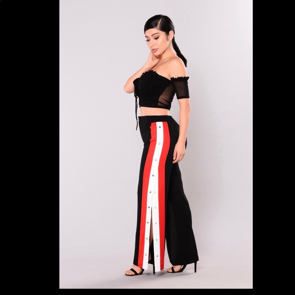Long black pants,red and white stripe button side
